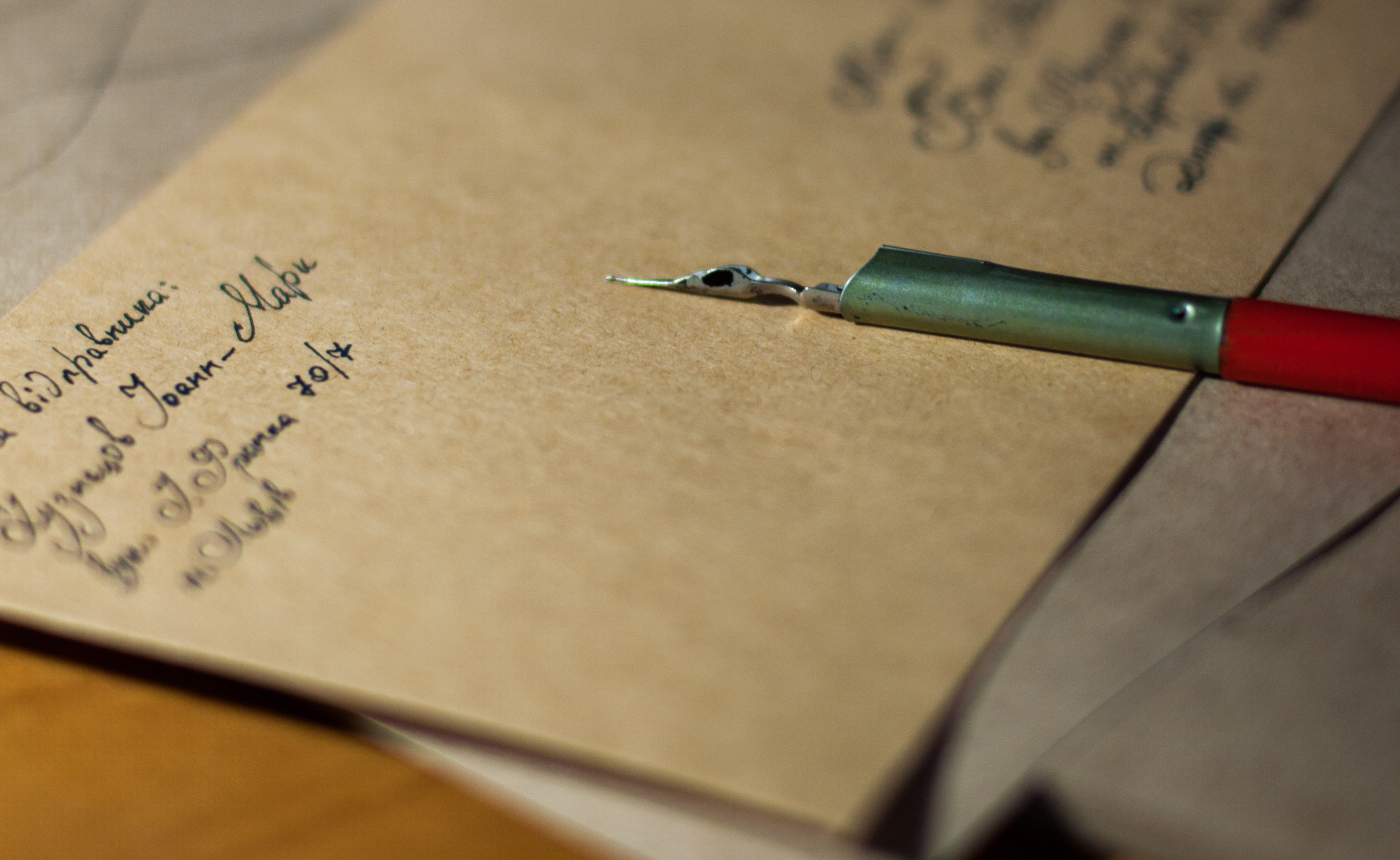 Image of a letter and a pen
