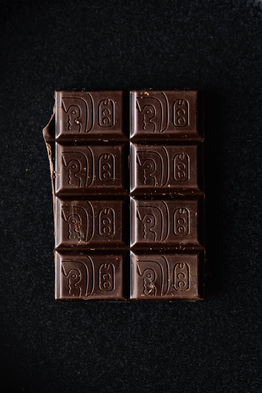 dark chocolate bar on black surface