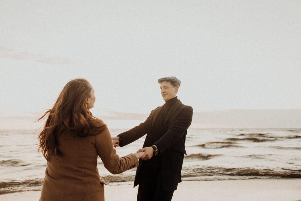 a couple dancing on the beach