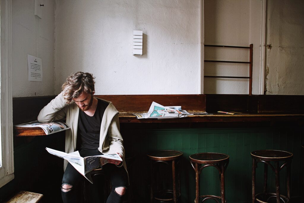 A man that seemed frustrated with what he is reading